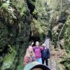 My friends and I in a canyon between two sandstone mountains