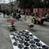This towel has vinyl records with images of famous bands; in the background, you can see people selling Russian hats, gas masks and beautiful rugs