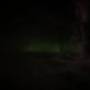 I saw the Northern Lights faintly in Keflavik when it was raining. Created by the collision of the Earth's gaseous particles and charged particles released from the sun's atmosphere, the aurora borealis are unpredictable and mystifying