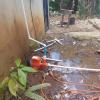 When my tinaco (water storage container) runs out of water, my neighbor helps me refill it using a bombita (pump/generator) that connects to the pipes