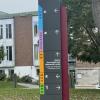 A sign on campus that indicates which buildings are located in which direction