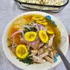 We made Ecuador's national food, encebollado, or an onion soup with fish, yuca, onions and chifles (plantain chips) on top.... or popcorn, if you eat it Andean-style!