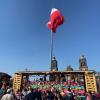 A train filled with flowers and catrinas at the Mega Ofrenda at the Zócalo