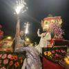 After the groom gets to the wedding on his horse, he climbs up into a chariot that's been decorated with flowers just for him! In this picture, his sister climbed up with him and was so excited that she started shooting fireworks into the air!