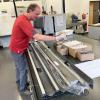  Each core is wrapped in plastic for storage, so the scientists started by unwrapping them before collecting samples