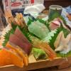 An array of different sashimi on a wooden board!