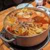 A really big pot of Japanese stew with different seafood and vegetables 