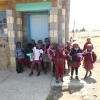 Some of the kindergarten students waiting outside their classroom