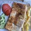 Gözleme is a traditional Turkish flatbread stuffed with ingredients like cheese, potatoes or spinach, then cooked on a griddle for a warm, savory treat