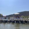 A traditional Korean funeral, with mourners carrying a 상여 (sang-yeo), or flower bier, across a bridge that's 1,000 years old