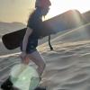 Me walking up a dune to sandboard down!