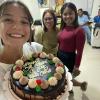 Celebrating four months in my community with a Goldilocks cake!