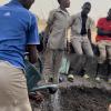 Students watering the garden