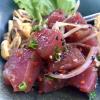 Seafood is fresh and delicious here. A meal of fresh, raw tuna and roasted corn.