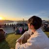 Me looking at the sunset in Oporto in the Jardim do Morro Park. This is a very popular spot to watch the sunset in Porto. 
