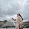 Posing at the Louvre Museum in Paris, France