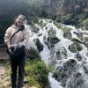 In front of the waterfall