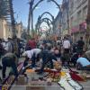 People working together on alfombras, intricate carpets made entirely from flowers, right in the middle of the street; it’s a true team effort!