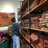 Nate looking at some hand-woven fabrics to take one home