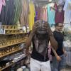 Trying on a "tagelmust" in a store in Morocco
