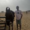 Me posing with the horse on the beach