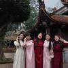 Here I am with my students at Lam Kinh. We are wearing áo dài, a traditional Vietnamese dress. We walked around the old buildings and enjoyed learning about history together.