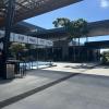 The courtyard of the airport, to the left you can see a tennis court where locals come to play tennis