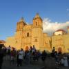 As the sun set in front of the Templo de Santo Domingo de Guzmán, its warm light illuminated the facade