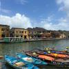 This is a photo of the river and boats of Hoi An during the day
