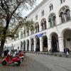 The front of LMU Munich's main building (with festive flags!)