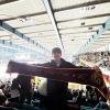 Me holding the scarf and cheering at a hockey game.