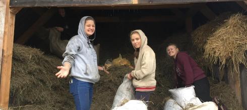 Here are me and my students collecting feed from the barn for the animals at Pasíčka