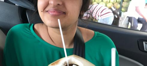 Enjoying some refreshing coconut water straight from the coconut