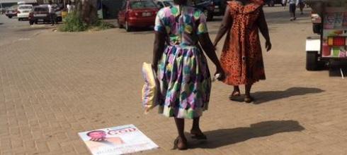 Women on their way to sell kente cloth