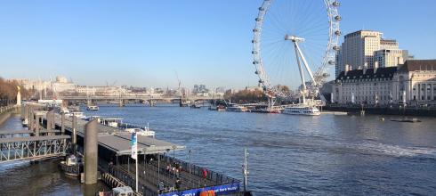 View over the River Thames toward the London Eye (the giant ferris wheel)