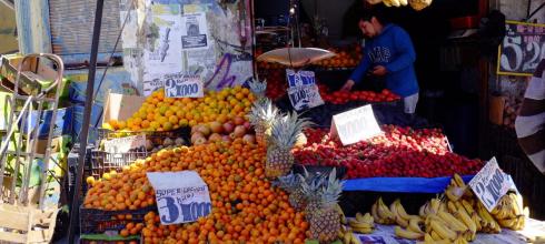 Street vendors sell fruit, vegetables and other items in the city center
