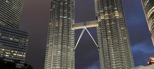 Petronas Twin Towers with fountain show at night