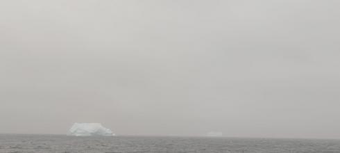 View of iceberg from the port hole of the ship!