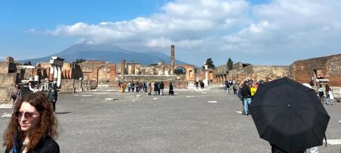 Ancient ruins of Pompeii with Mount Vesuvius shown in the background (under the clouds!) 