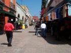 People walking down a street in Querétaro (Photo from Flickr)