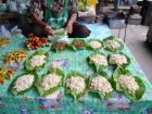 Red ant eggs displayed on leaves at a market in Thailand (Photo from Wikimedia Commons)