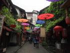 An alleyway in an ancient town in Chongqing. Filled with different stalls where vendors sell everything from knickknacks to traditional foods. A cultural explosion!