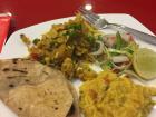 An average dinner here: roti, rice, fresh vegetables and curry