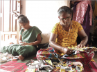 AnuLife women handcrafting more bags
