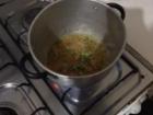 In the pot there is "sofrito" - a mix of onions, peppers, and garlic. 