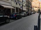 Parked cars in the middle of the city center-- it is very rare to see an open spot!
