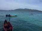 Malaysia is home to many beautiful islands, and people use boats such as these to travel between them