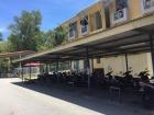 Can you guess why students store their bikes under roofed coverings?