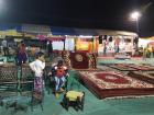 Many people were selling rugs, beautiful lamps and fold out beds at the fair