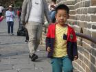 A really smart kid watching his step so he won't slip